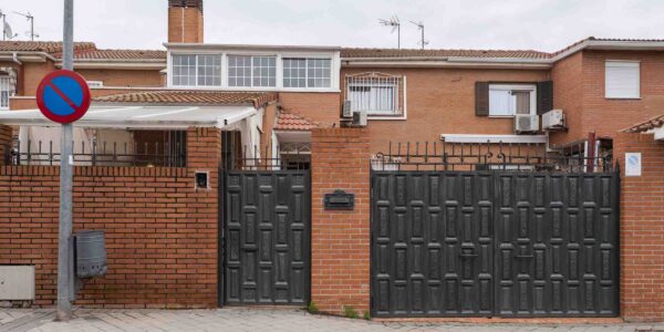 Metal portals of a detached house built with clay brick